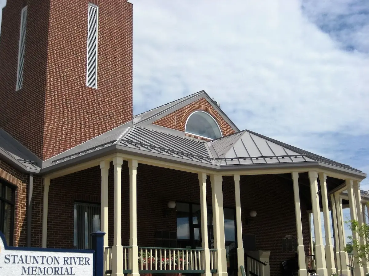 Skilled roofing craftsmen working on a residential roof in Westover
